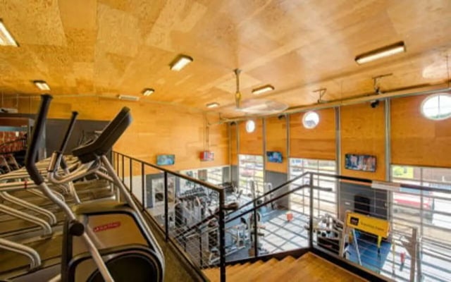 Elliptical machines and gym equipment recreation area at Knollwood Apartments in Kalamazoo Student Accommodation