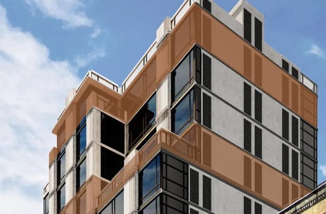 Modern building with large windows and balconies exterior at Monarch Heights Apartments
