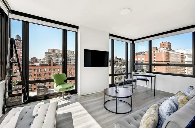 Modern living room with sofa chair coffee table living room at Monarch Heights Apartments
