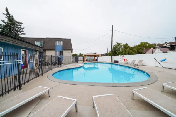 Pool with lounge chairs and gazebo outdoor area at Monticello Apartments in Provo Student Accommodation