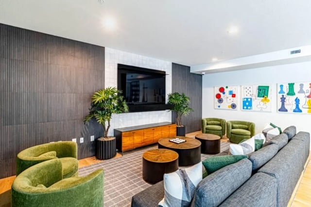 Modern lounge with large sectional sofa and tv Living room at Pointe San Marcos in San Marcos Student Accommodation