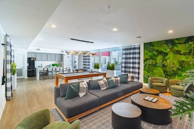 Sofa pool table kitchen modern living area at Pointe San Marcos in San Marcos Student Accommodation