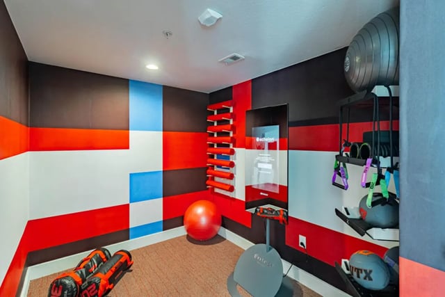 Exercise equipment weight balls and workout gear fitness room at Pointe San Marcos in San Marcos Student Accommodation