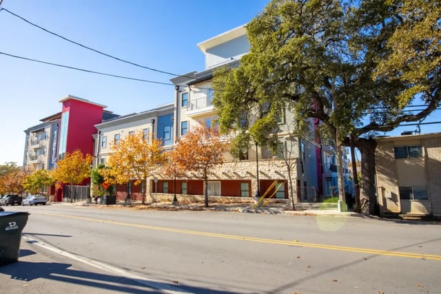 Modern apartments with balconies and trees exterior at Pointe San Marcos in San Marcos Student Accommodation