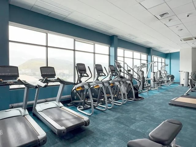 Treadmills elliptical machines weight machines fitness room at Hale Mahana in Honolulu Student Accommodation
