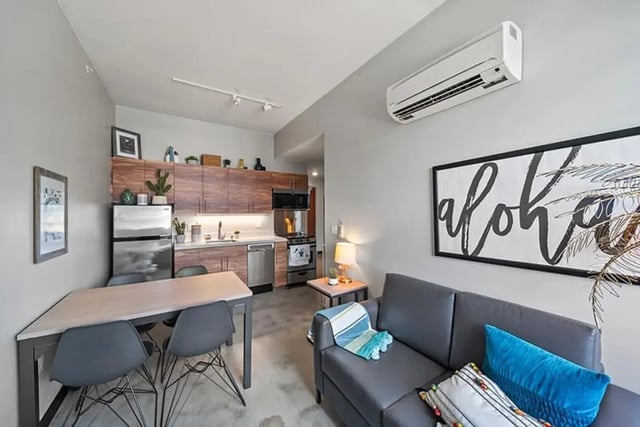 Living area with kitchen dining and sofa living room at Hale Mahana in Honolulu Student Accommodation