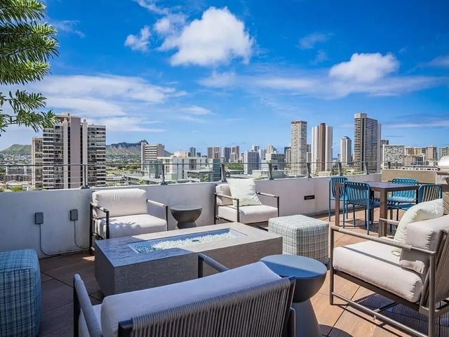 Rooftop seating with city view exterior at Hale Mahana in Honolulu Student Accommodation