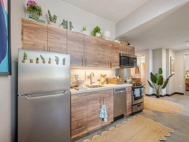 Stainless steel fridge sink cabinets stove kitchen at Hale Mahana in Honolulu Student Accommodation