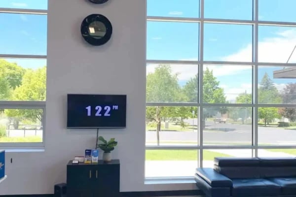 Wall mounted television plant black cabinet lounge area exterior at The Factory Student Housing in Logan Student Accommodation