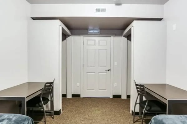 Two desks chairs and doors Study Area at The Factory Student Housing in Logan Student Accommodation