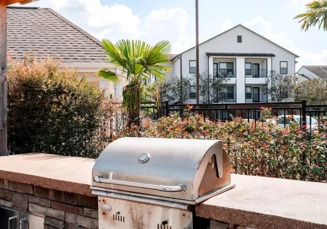 Built-in grill and floral bushes exterior at Lakeside Student Living in Starkville Student Accommodation