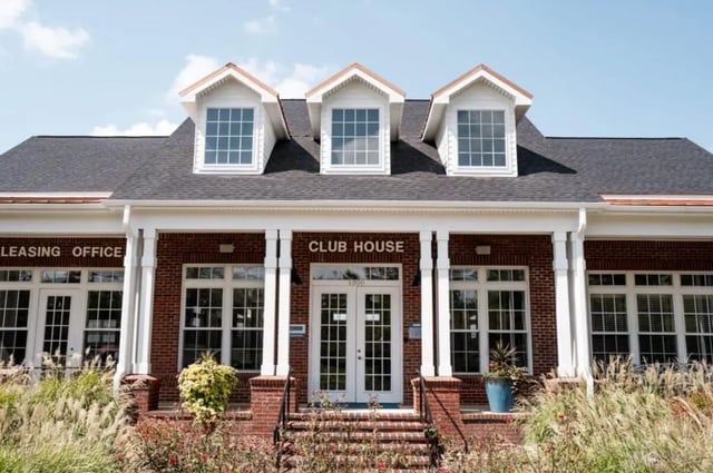Club house entrance with brick exterior exterior at Lakeside Student Living in Starkville Student Accommodation