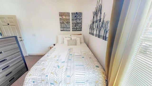 Bed with New York cityscape duvet chest door Bedroom at Lakeside Student Living in Starkville Student Accommodation
