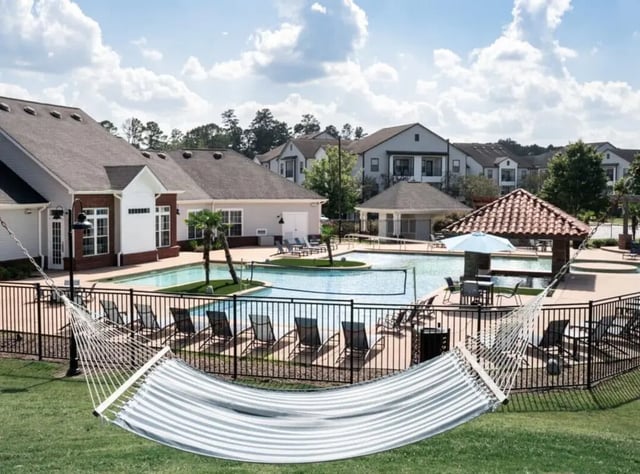Hammock by pool with lounge chairs exterior at Lakeside Student Living in Starkville Student Accommodation