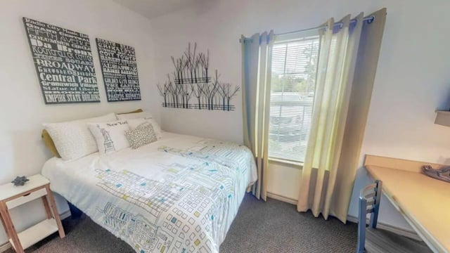 Bed with New York art desk and window bedroom at Lakeside Student Living in Starkville Student Accommodation