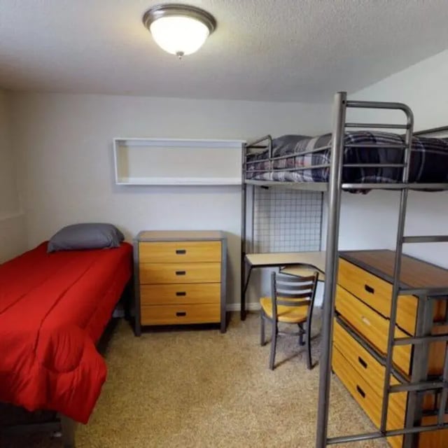 Bunk bed desk dresser and single bed bedroom at The Pines in Rexburg Student Accommodation