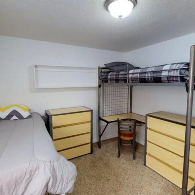 Bunk bed desk dressers and bed bedroom at The Pines in Rexburg Student Accommodation