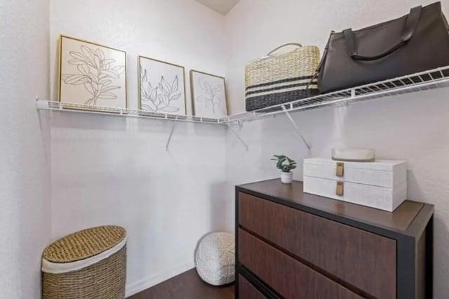 Drawings on wall storage baskets dresser bedroom closet at The Hudson in Albany Student Accommodation