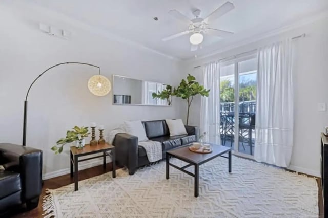 Black sofa coffee table patterned rug living room at The Hudson in Albany Student Accommodation