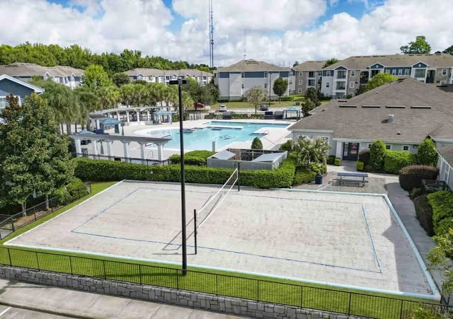 Volleyball court and swimming pool exterior at The Hudson in Albany Student Accommodation