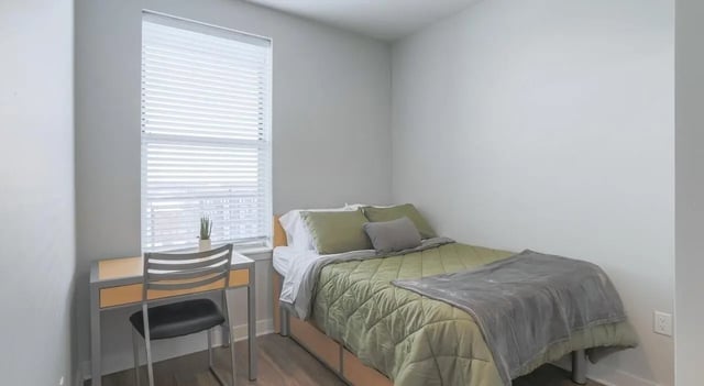 Bed desk and chair in a bedroom at Lancaster Apartments in Champaign Student Accommodation