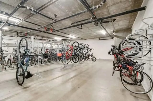 Many bicycles are stored in racks interior bicycle storage at Summit SLO in San Luis Obispo Student Accommodation