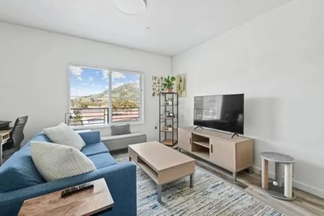 Blue sofa coffee table and TV living room at Summit SLO in San Luis Obispo Student Accommodation