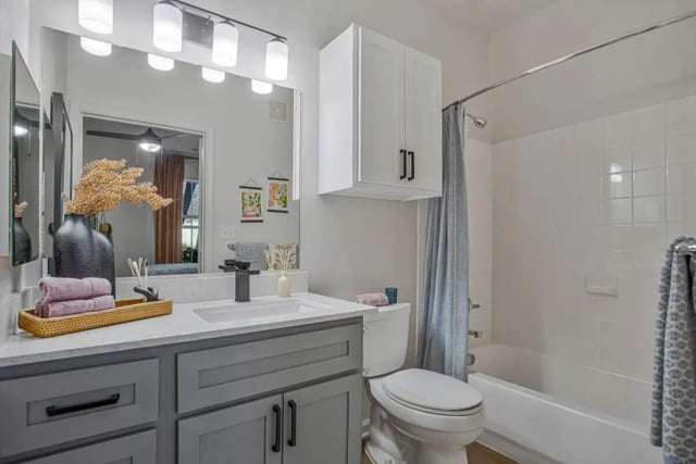 Vanity toilet tub shower curtain bathroom at Mazza GrandMarc in College Park Student Accommodation