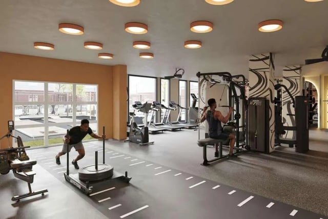 Men exercising on gym equipment fitness room at Mazza GrandMarc in College Park Student Accommodation