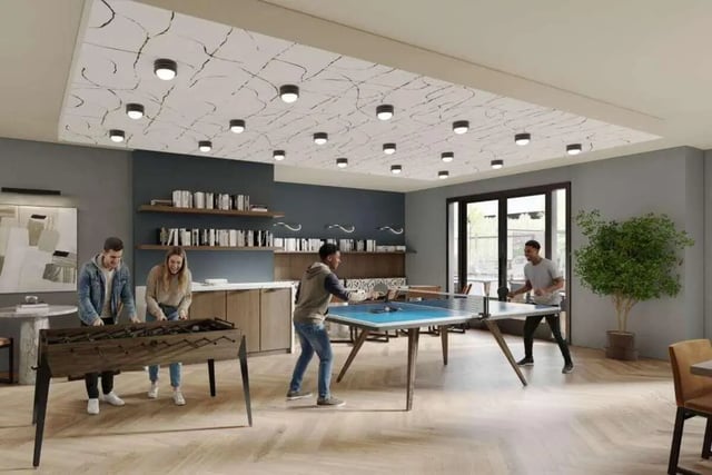 Foosball and ping pong tables with players Game room at Mazza GrandMarc in College Park Student Accommodation