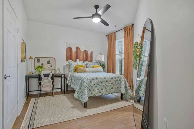 Bed desk rug with backpack and mirror bedroom at Mazza GrandMarc in College Park Student Accommodation