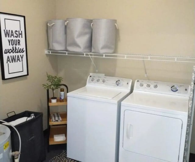 Laundry area with washer dryer and storage baskets laundry area at University Edge Apartments Bldg 1 in South Bend Student Accommodation