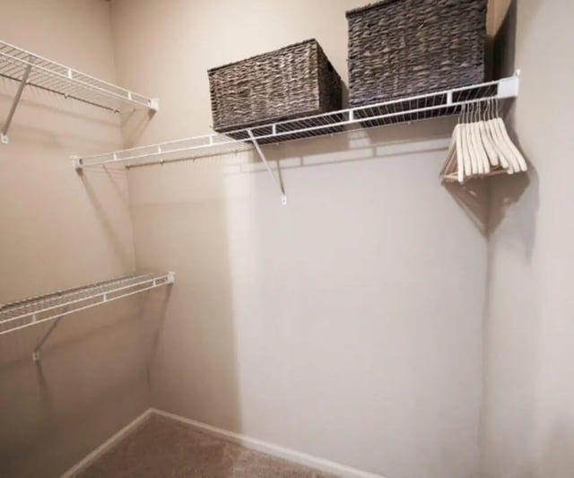 Wire shelving baskets and hangers closet at The Hamptons Statesboro in Statesboro Student Accommodation