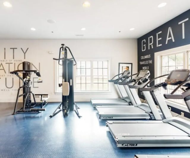 Weight machines treadmills and motivational text Gym at The Hamptons Statesboro in Statesboro Student Accommodation