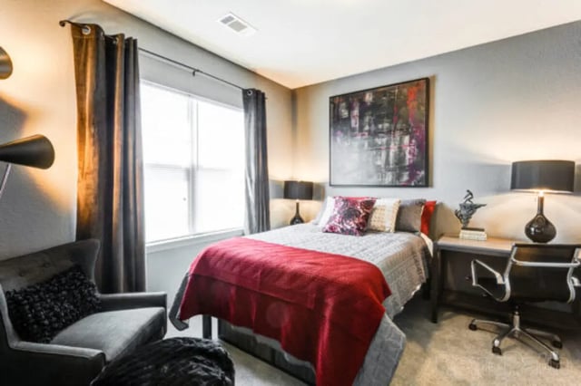 Bed desk chair abstract art bedroom at Stadium View in Ames Student Accommodation