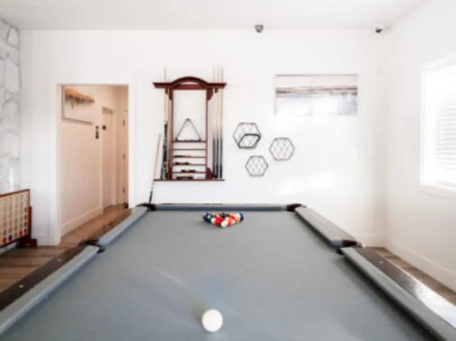 Pool table cues rack and balls recreation room at Village on the Parkway in Orem Student Accommodation