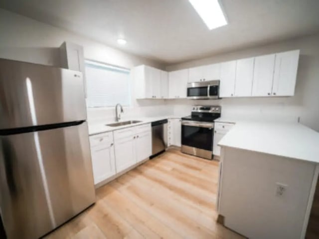 Stainless steel refrigerator stove cabinets sink kitchen at Village on the Parkway in Orem Student Accommodation