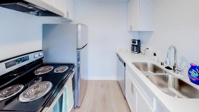 Stove refrigerator sink coffee maker kitchen at Wildcat Crossing in Chico Student Accommodation