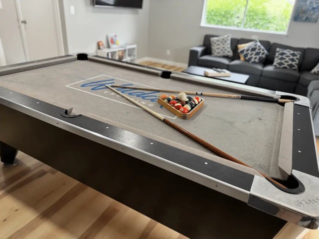 Pool table with balls and cues recreation area at Wildcat Crossing in Chico Student Accommodation