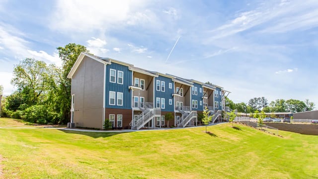 Apartment complex with blue siding and stairs exterior at Landmark Athens in Athens Student Accommodation
