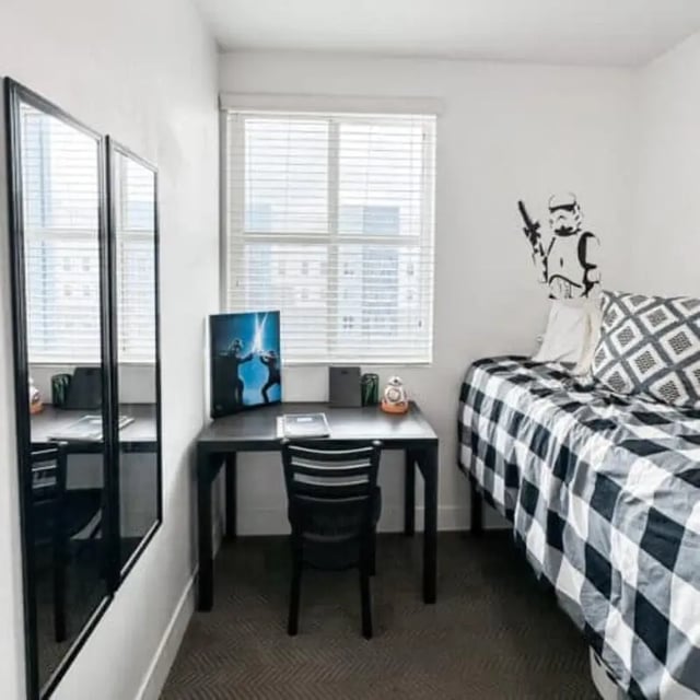 Desk mirrors bed with stormtrooper decal bedroom at Promenade Place in Orem Student Accommodation