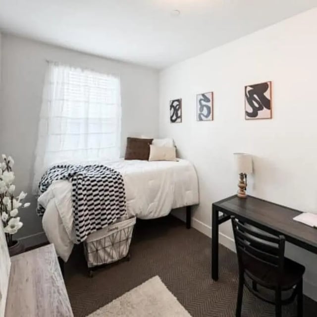 Bed desk chair artwork white bedroom. at Promenade Place in Orem Student Accommodation