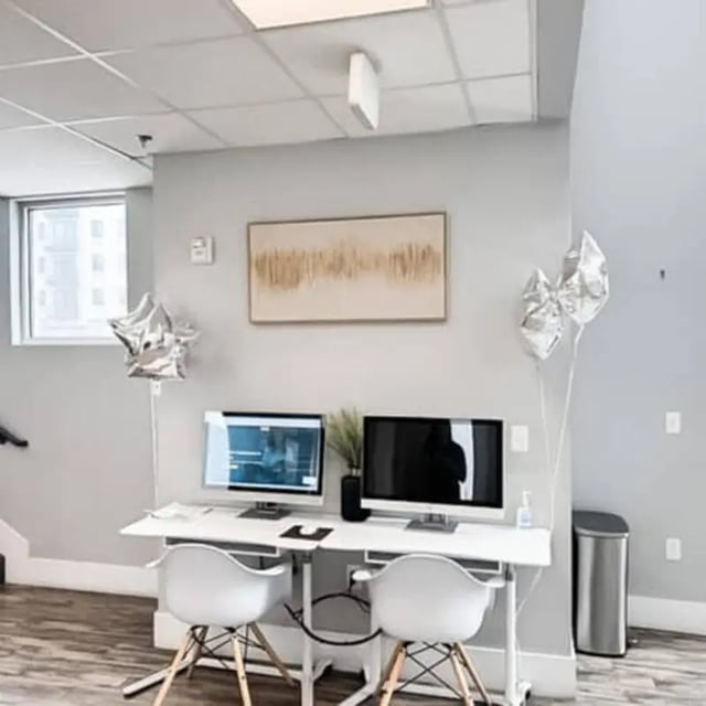 Two computers on white desks with chairs study area at Promenade Place in Orem Student Accommodation