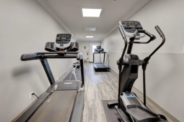 Treadmills and elliptical machines gym area at The Colonial House in Rexburg Student Accommodation