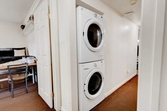 Stacked washer dryer desk chair bed bedroom area at The Colonial House in Rexburg Student Accommodation