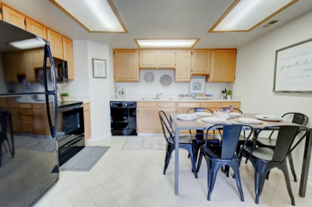 Kitchen with dining table and chairs kitchen at The Colonial House in Rexburg Student Accommodation