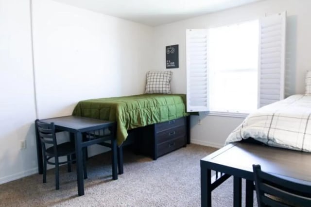 Two beds desks and chairs bedroom at Nauvoo House Apartments in Rexburg Student Accommodation