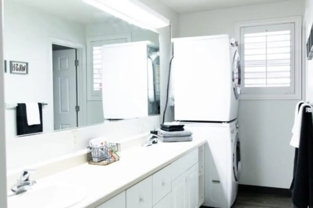 Washer dryer stack sink vanity bathroom at Nauvoo House Apartments in Rexburg Student Accommodation