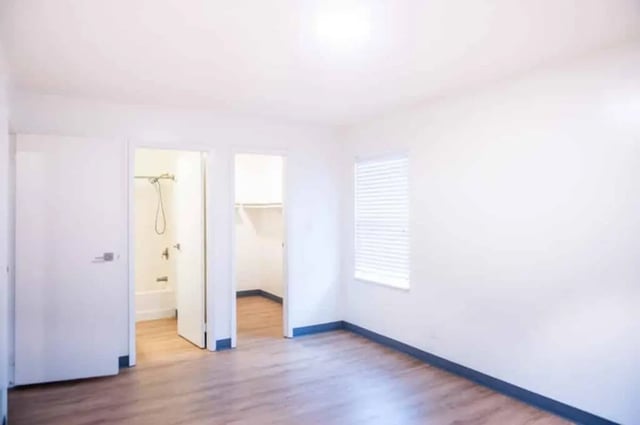 Open doors show shower and closet Bedroom area at Silvertree Communities in Muncie Student Accommodation