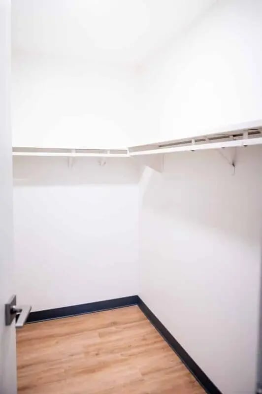 Empty closet with wood floor and shelves closet at Silvertree Communities in Muncie Student Accommodation